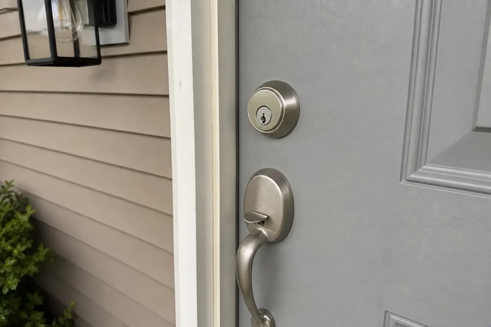 New deadbolt being installed in a front door in Waterbury, CT